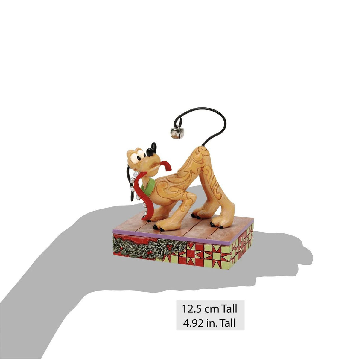Celebrate Pluto's 95th anniversary with this enchanting Jim Shore scene, where Pluto conducts his own symphony of jingle bells, shaking a bell adorned collar and using his tail as an instrument.