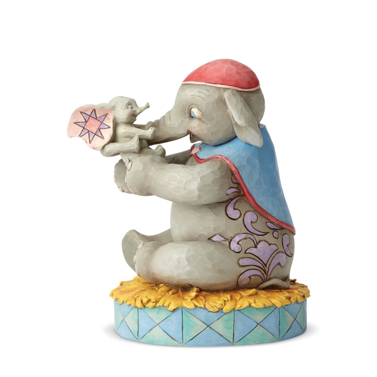 Disney Mrs Jumbo and Dumbo Figurine A Mother's Unconditional Love by Jim Shore  Fiercely protective and unconditionally loving, Mrs. Jumbo cherishes her big-eared baby Dumbo. Handcrafted and hand-painted in exquisite detail, this cast stone figurine by Jim Shore makes a beautiful keepsake for Mother's Day or as a new mum gift.