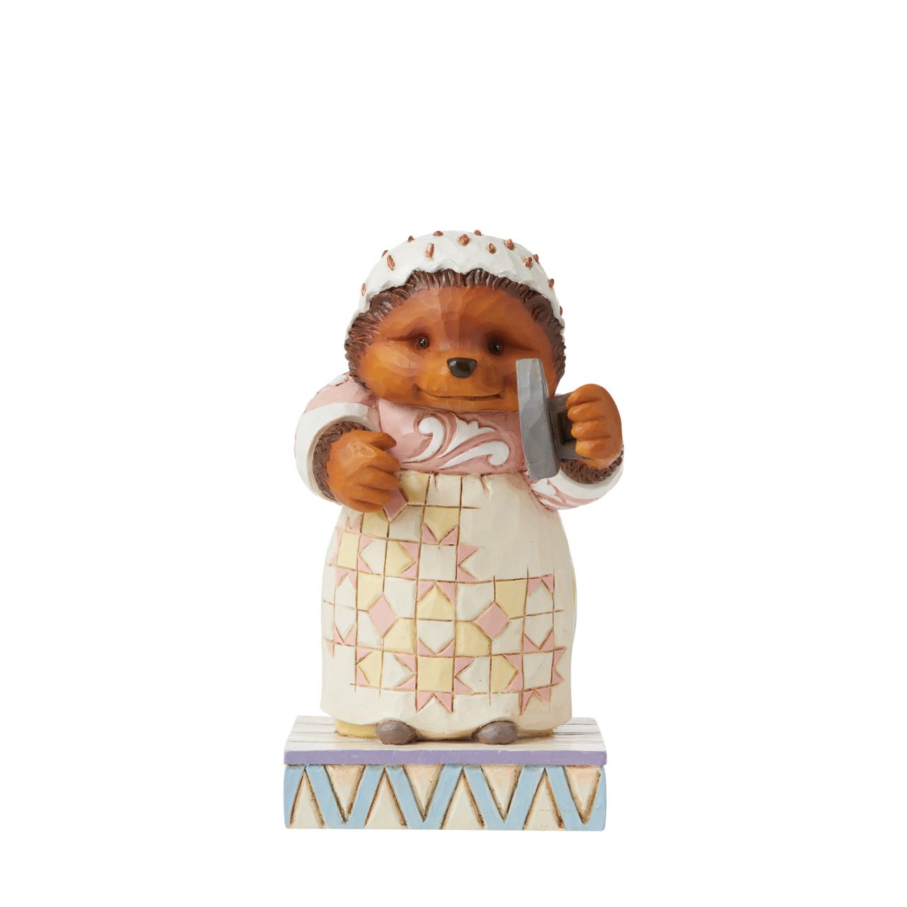 This Jim Shore figurine features the sociable hedgehog, Mrs. Tiggy-Winkle smiling sweetly, with iron in hand.