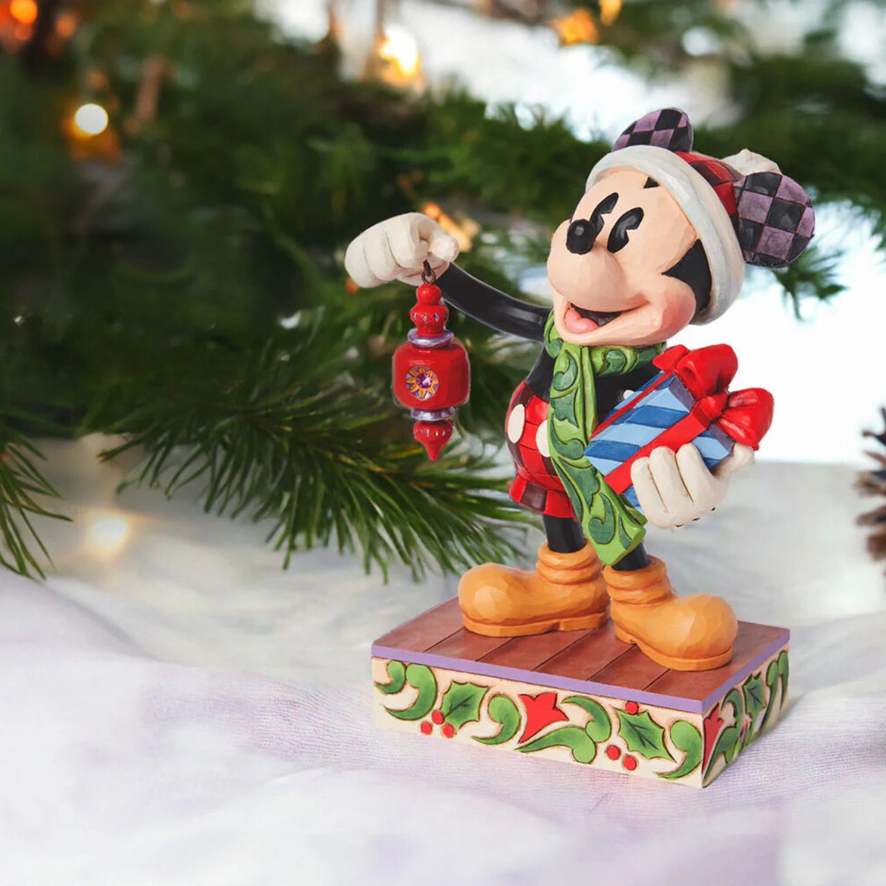 Produced in limited quantities especially for the 2024 World Wide Christmas Event, this piece is perfect for kicking off Christmas early. Featuring the iconic Mickey Mouse with a hanging ornament dangling from his hand and a festive Santa hat upon his head, this is the perfect addition to any Disney Collection.