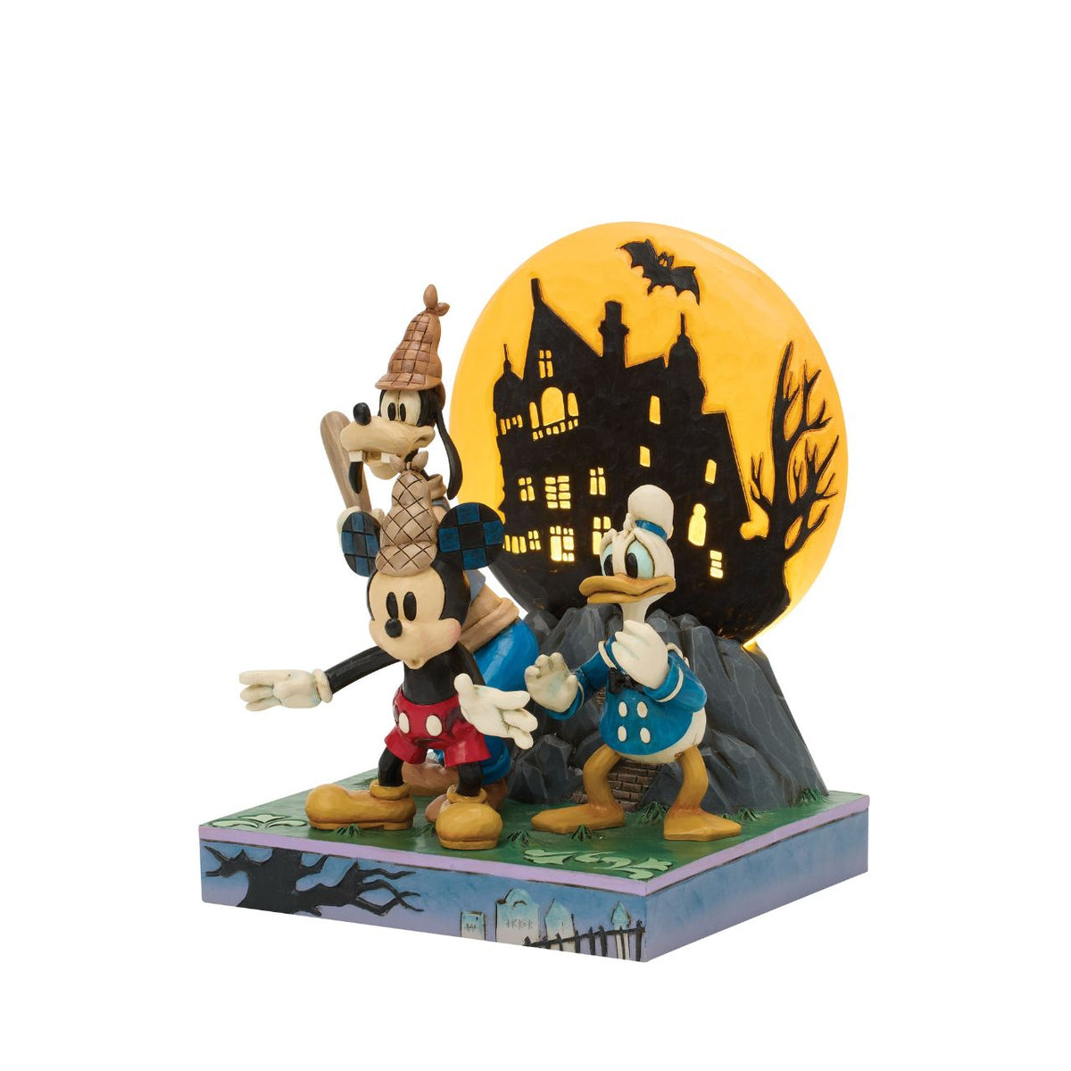 Disney's Mickey, Goofy, and Donald appear with scared expressions in this spooky Jim Shore design. Goofy holds a bat while an LED moon glows behind them, adding eerie charm and detailed folk-art flair to their ghostly adventure.