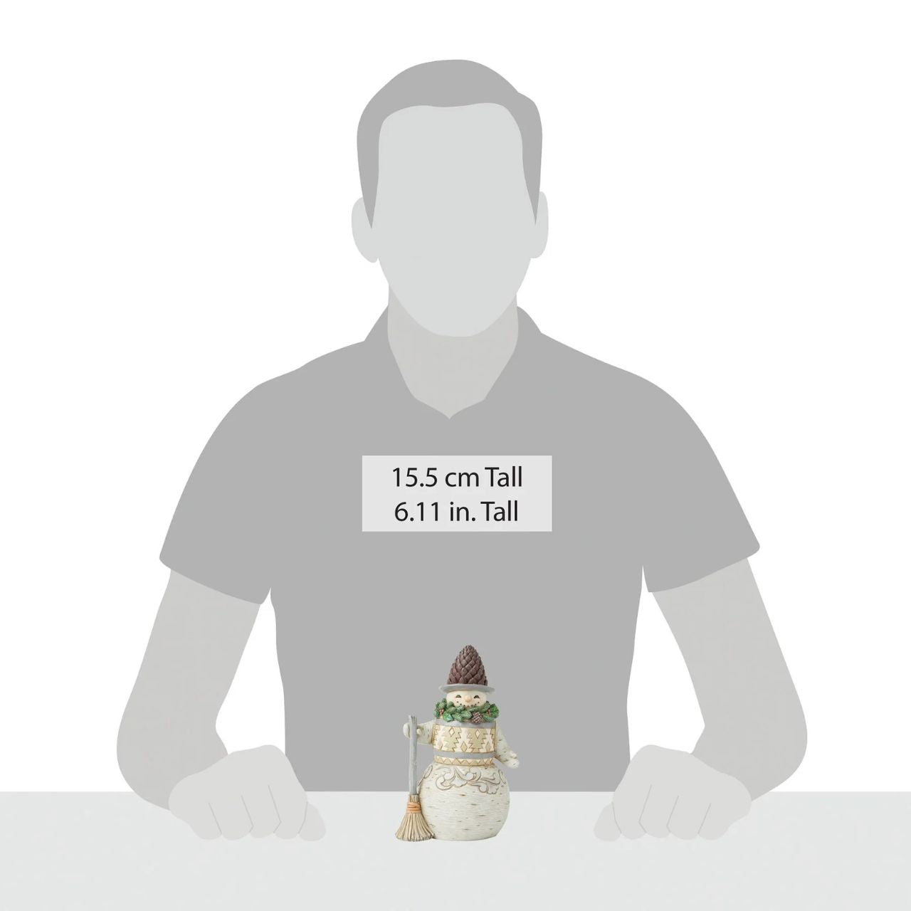 This cheerful Jim Shore designed snowman carrying a broomstick, sure is exuding charm with a wreath wrapped around his neck as a scarf and a pinecone hat. His delightful details capture the beauty of winter and the joy of the season.