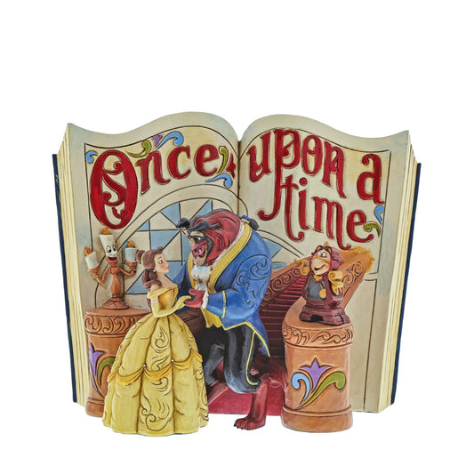 A tale as old as time and a song as old as rhyme... this beauty and her beast takes storybooks into a whole new dimension. Designed by award winning artist and sculptor, Jim Shore for the Disney Traditions brand. Book title written in gold paint on the back of the book. 