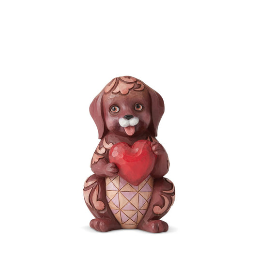 Love Is A Faithful Friend Dog Holding Heart Pint-Sized  Love is what keeps us smiling. This amorous Jim Shore puppy holds a crimson heart in its paws with a bright grin upon its face, confident to bring one to your own.