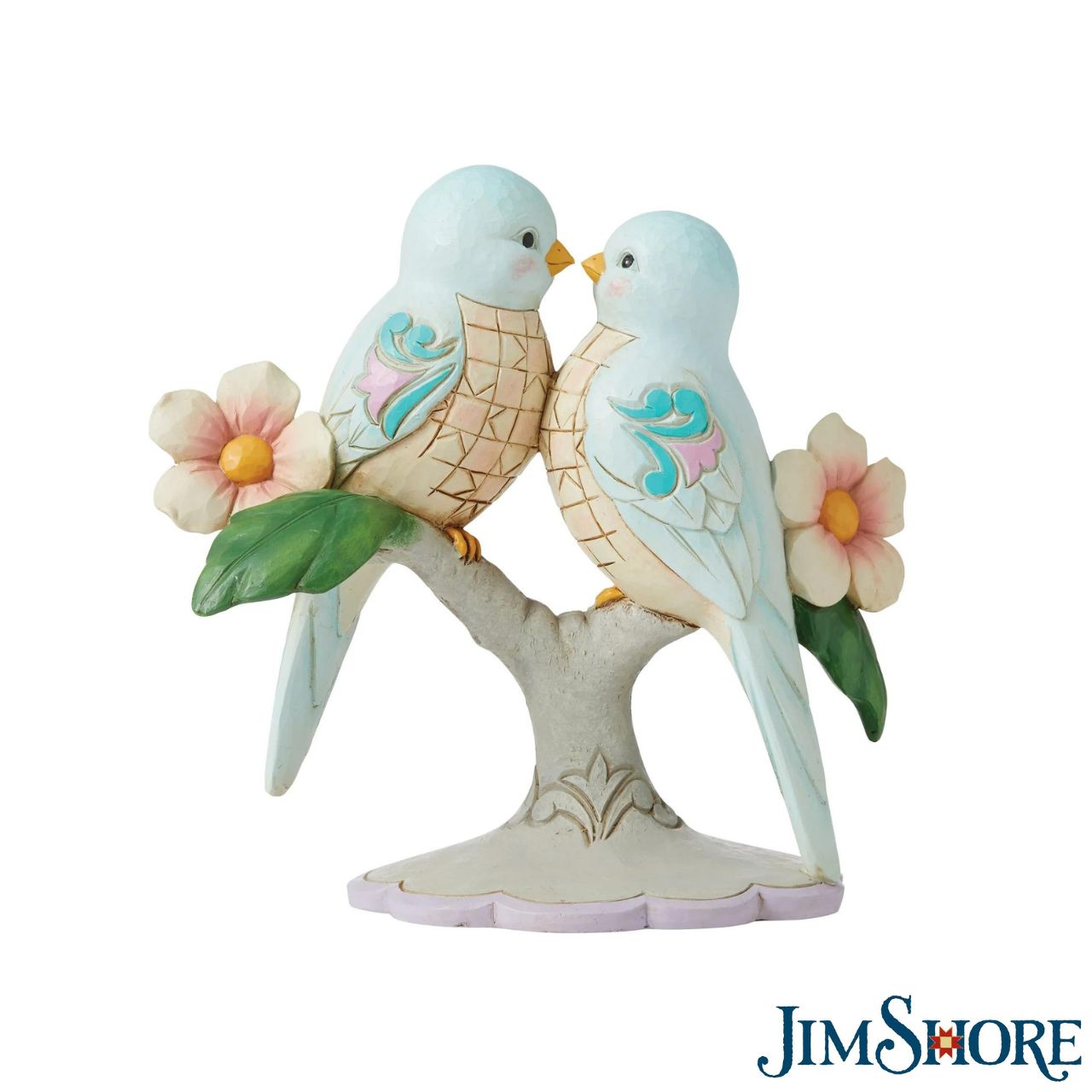 Jim Shore Lovebirds Figurine  "Perfect Harmony" Beak to beak, these two bluebirds stare into each other's eyes with understanding and appreciation. Honouring both love and friendship, the pair share a branch of pink flowers and beautifully patterned matching plumage in this Jim Shore gift.