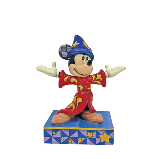 Celebrating the 85th anniversary of Fantasia in 2025, this Jim Shore Mickey Mouse is striking in red robes adorned with real gold cord and intricate rosemaling. With his sorcerer's hat, Mickey embodies the magic and wonder of the beloved classic.