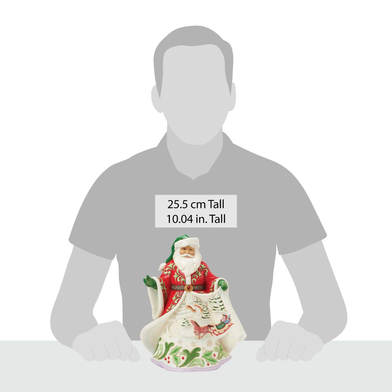 This Jim Shore First Edition Santa showcases the artist's signature rosemaling on a beautifully detailed coat that opens to reveal a cosy winter scene of a horse-drawn sleigh gliding through the snow while playing Over the River. Each piece is signed by Jim Shore on a special under stamp and numbered 1-1000 worldwide.