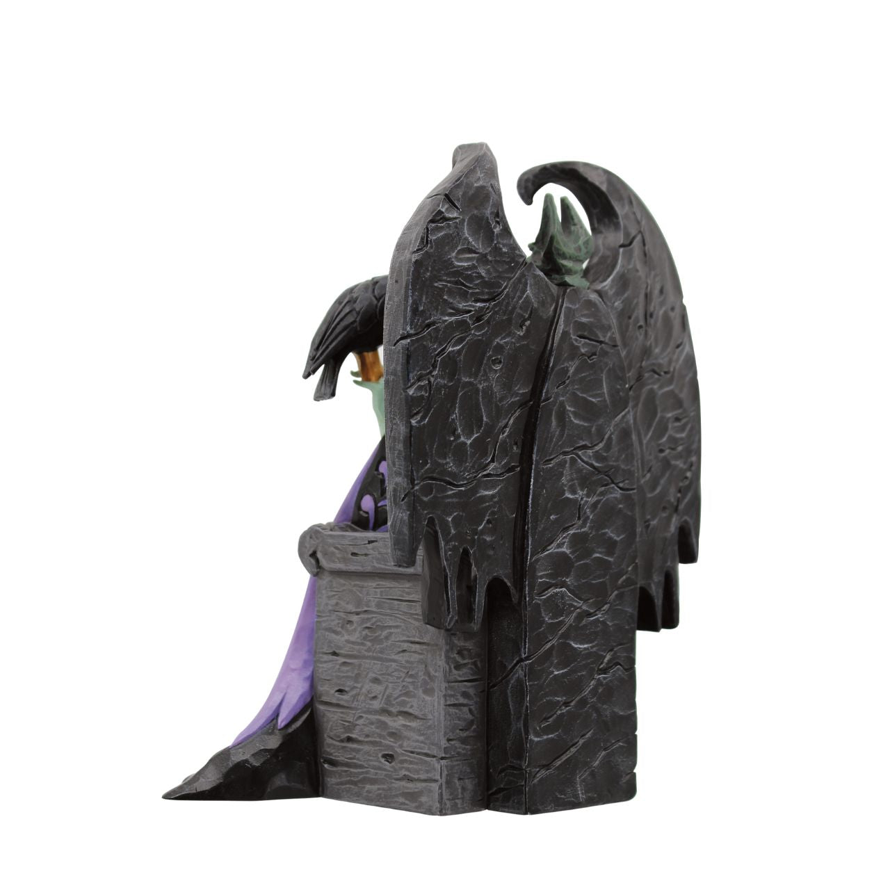 Maleficent sits atop her throne with her raven, Diavel. Dressed in her signature black with horned headdress, she is every piece the iconic villain from Sleeping Beauty. Designed by Jim Shore for his Disney Traditions collection.