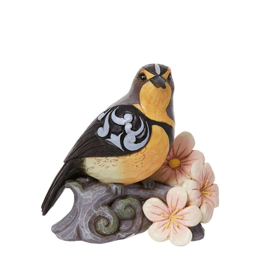 Meadowlark with Flowers by Jim Shore  Bring the great outdoors inside with this gorgeous bird bust. Sitting on a branch covered in flowers, this 5" Meadowlark adds grace to any home. Jim Shore's trademark patchwork and rosemale details are complimented by her brightly coloured feathers.
