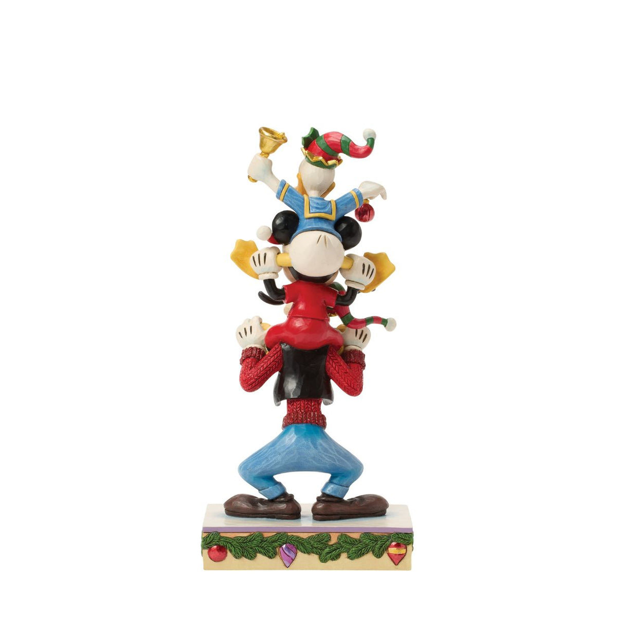 Jim Shore captures Disney's beloved trio in a joyful tower of friendship. With Donald Duck balanced atop Mickey Mouse and Goofy holding steady, this colourful design celebrates laughter, teamwork, and the timeless magic of Disney pals.