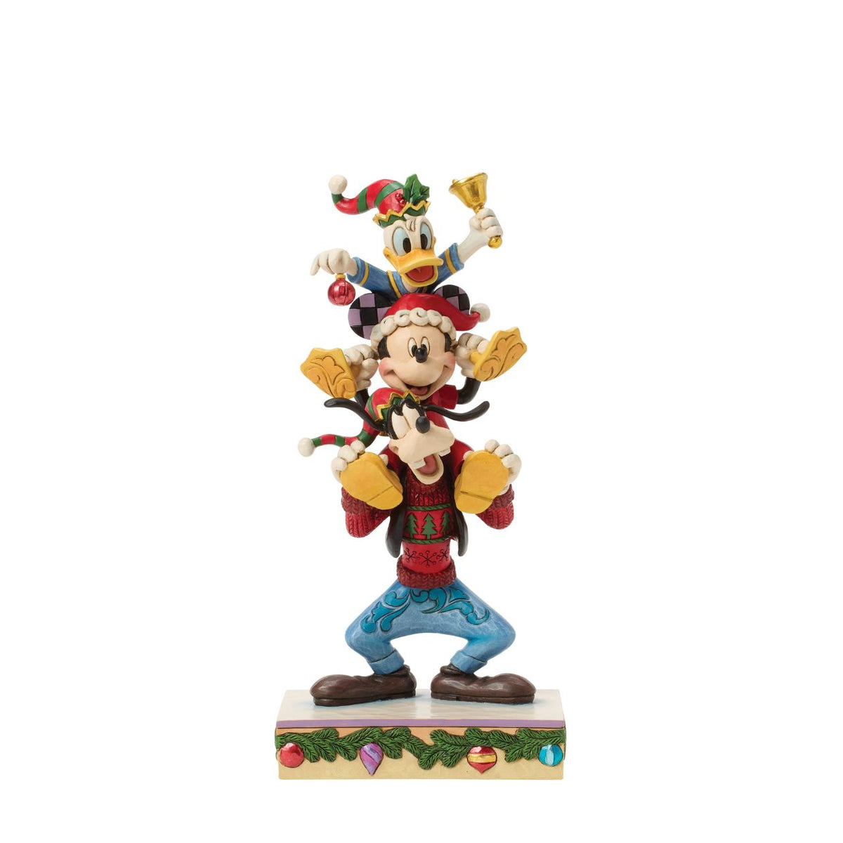 Jim Shore captures Disney's beloved trio in a joyful tower of friendship. With Donald Duck balanced atop Mickey Mouse and Goofy holding steady, this colourful design celebrates laughter, teamwork, and the timeless magic of Disney pals.