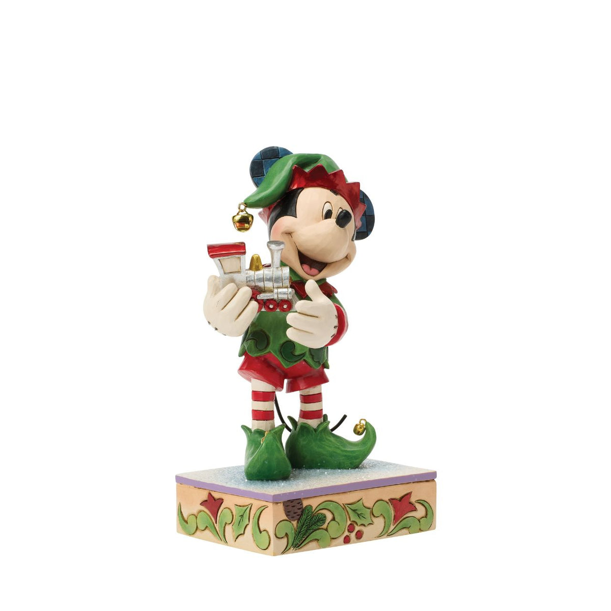 Mickey is Santa's helper as he hand delivers a festive toy train in this Special Edition Jim Shore holiday bust. Featuring bright folk art details and a sparkling gem on the engine, Mickey the elf brings holiday wonder to any Christmas display.