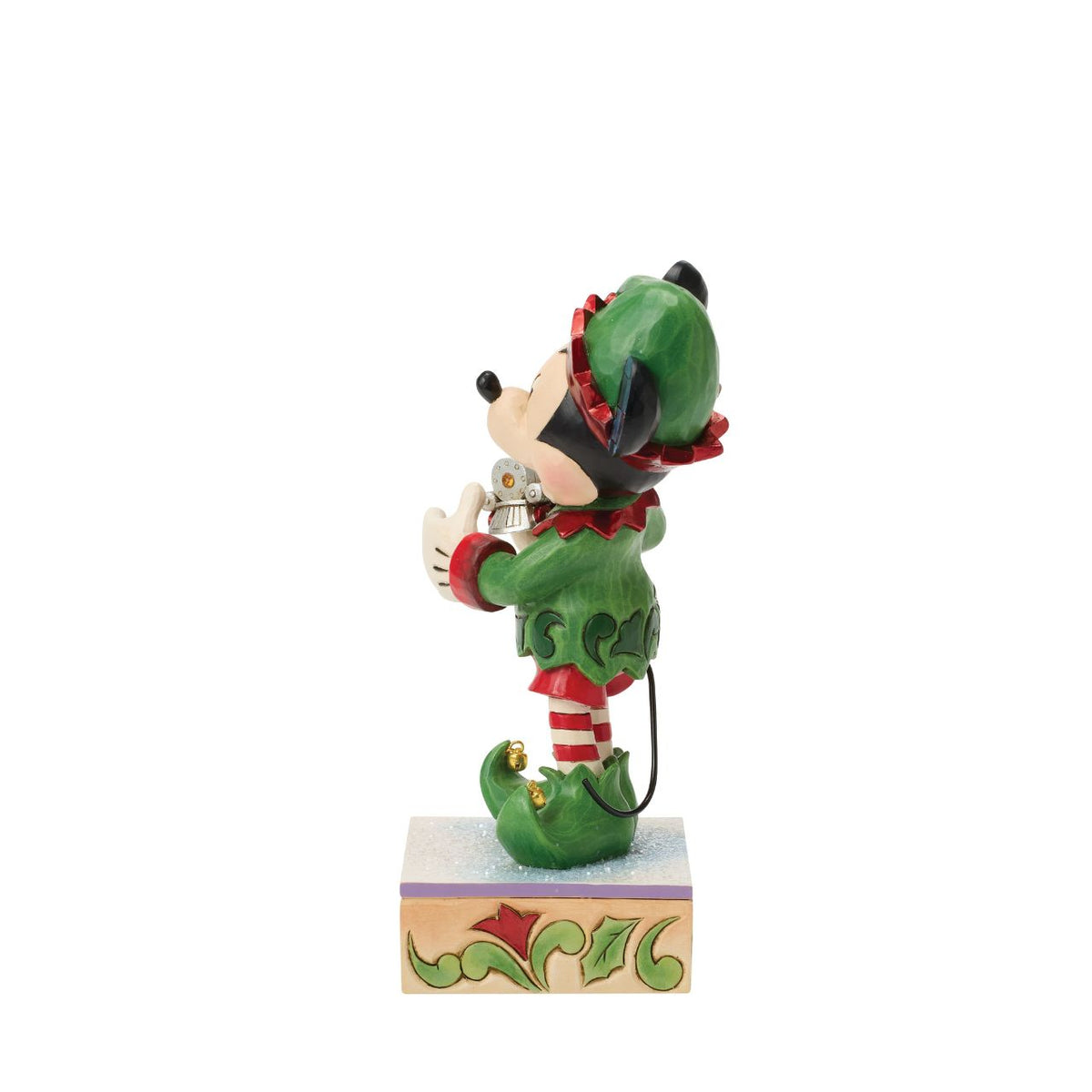 Mickey is Santa's helper as he hand delivers a festive toy train in this Special Edition Jim Shore holiday bust. Featuring bright folk art details and a sparkling gem on the engine, Mickey the elf brings holiday wonder to any Christmas display.