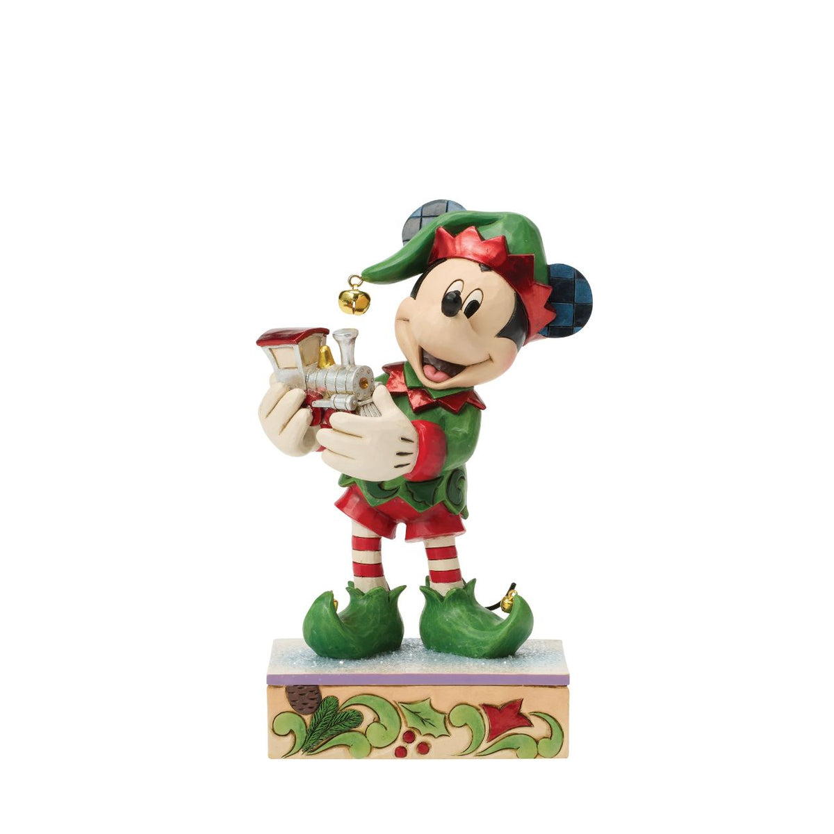 Mickey is Santa's helper as he hand delivers a festive toy train in this Special Edition Jim Shore holiday bust. Featuring bright folk art details and a sparkling gem on the engine, Mickey the elf brings holiday wonder to any Christmas display.
