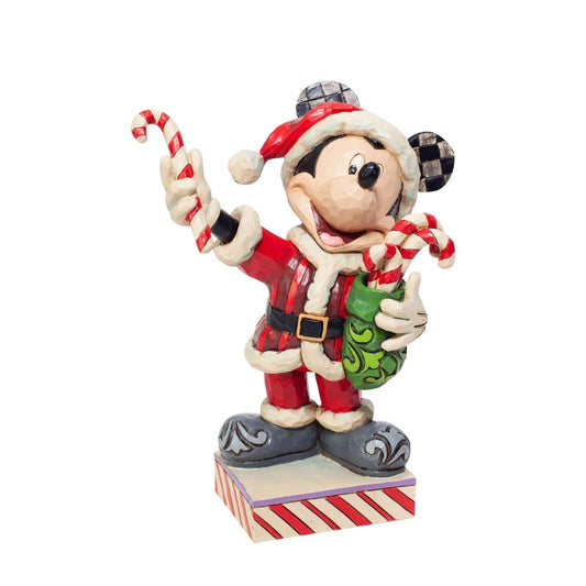 Disney Mickey Mouse with Candy Canes Figurine  Dressed in a Santa suit, Mickey masquerades as the holiday titan. Delivering candy canes to all the nice people he knows, he brings the spirit of Christmas wherever he goes. Celebrate the most wonderful time of the year with Disney by Jim Shore.