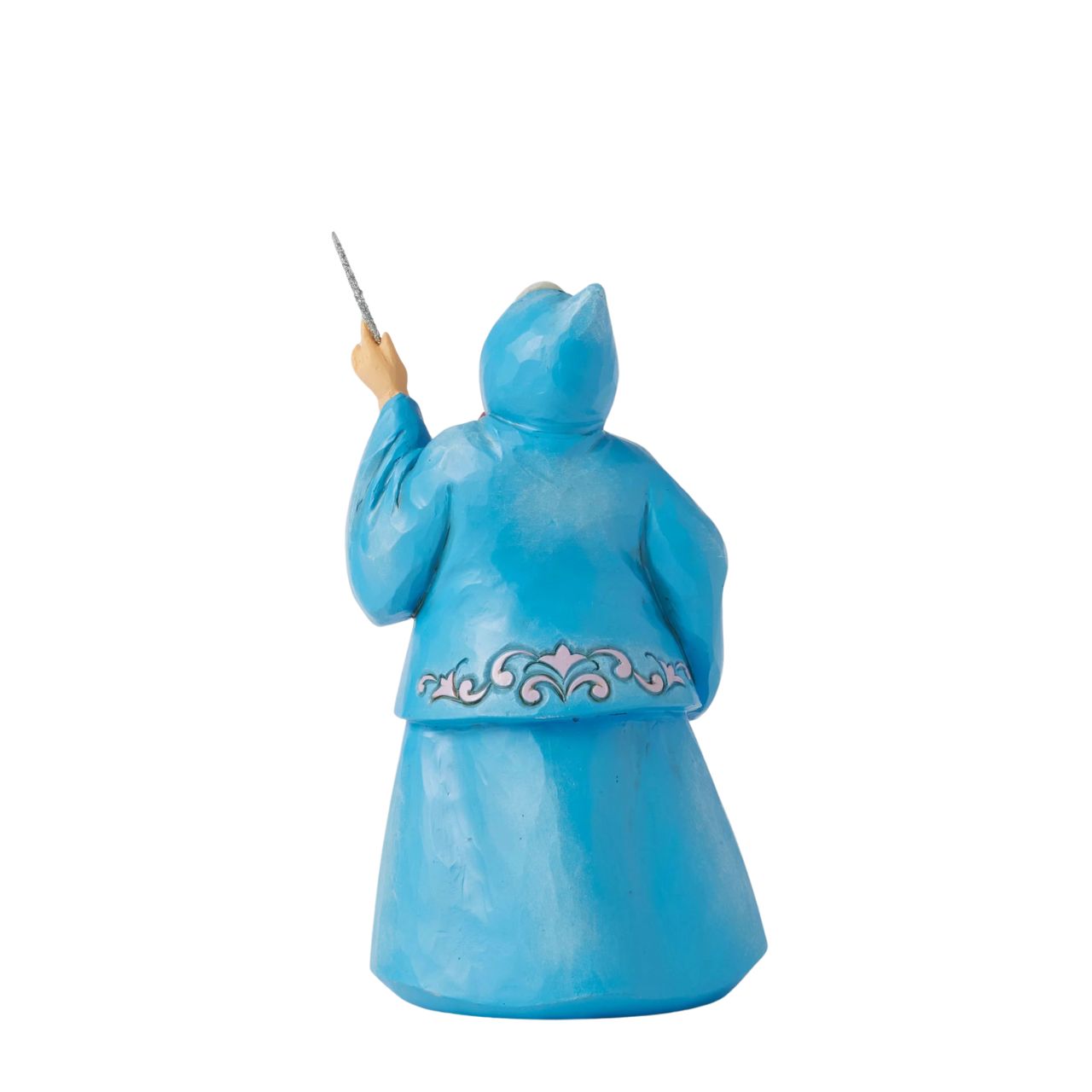 In this magical Jim Shore design, the Fairy Godmother smiles with her wand, her rosemaling blue robes parting to reveal Cinderella racing down the steps as the clock strikes midnight. This captivating moment is when she will lose her glass slipper.