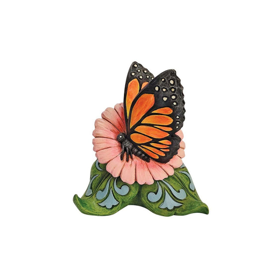 Mini Monarch Butterfly Figurine by Jim Shore  The monarch butterfly considered to be the king of butterflies and the most beautiful in all the world. Bring some of that beauty into your home with this astonishing bust by Jim Shore. Resting on a rosemale flower, it shows off its enchanting wings.