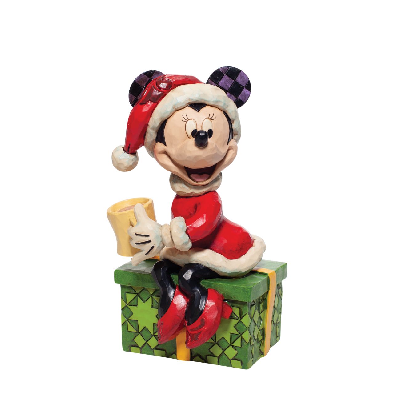 Disney Minnie Mouse with Hot Chocolate Figurine  Dressed in a dainty Santa skirt and hat, Minnie soaks in the holiday spirit. Sipping from a cup of hot chocolate, this sweet mouse celebrates the most wonderful time of the year in style. Once again, Jim Shore captures the magic of Disney.