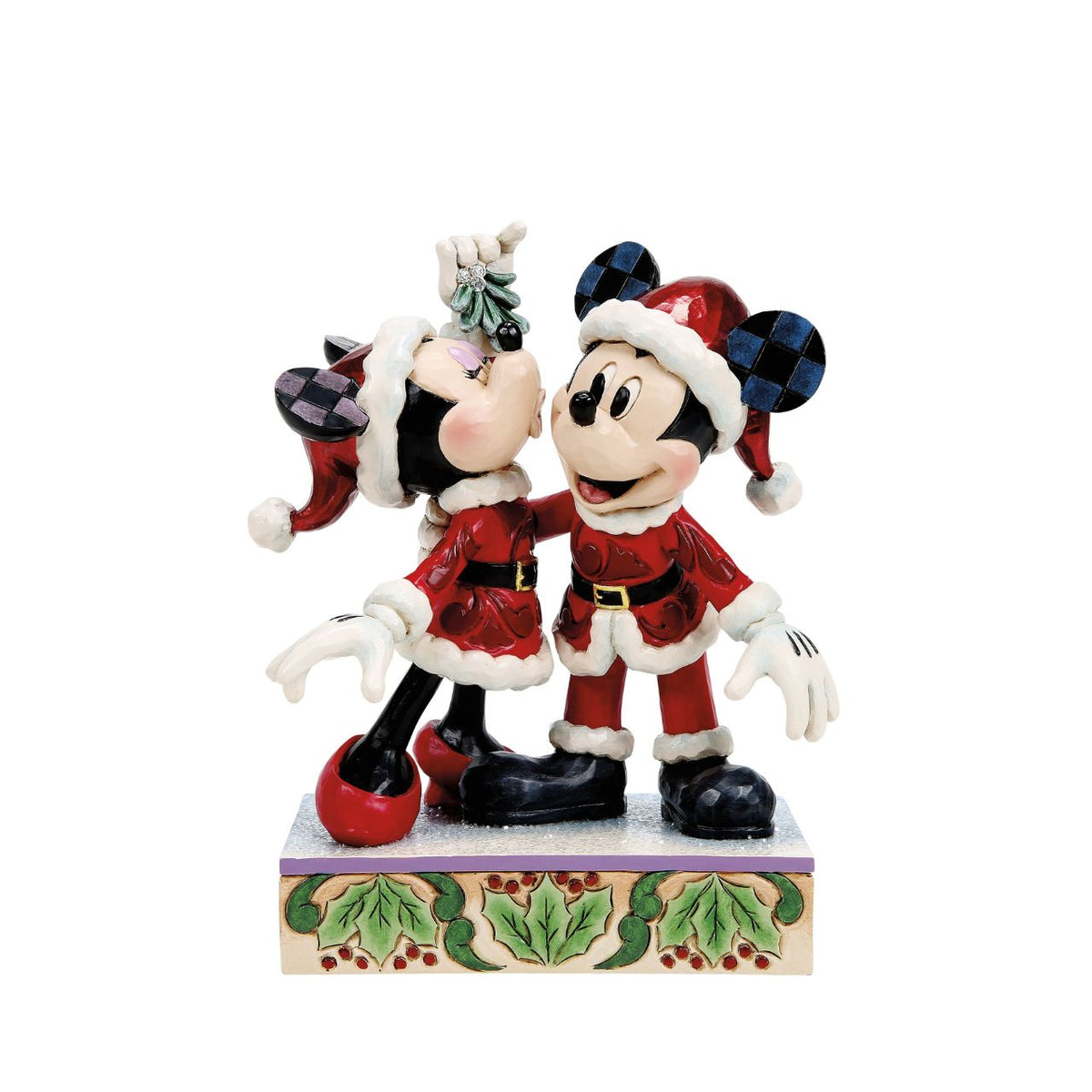 Romance fills the air as Mickey and Minnie Mouse share a kiss beneath the mistletoe in this darling Jim Shore creation. With festive details and folk art charm, it's a heartwarming reminder of holiday love and cheerful Christmas traditions.