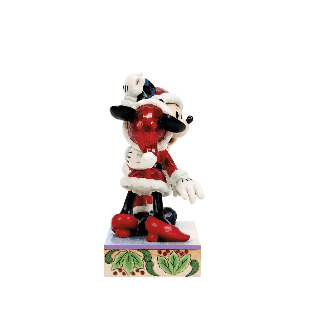 Romance fills the air as Mickey and Minnie Mouse share a kiss beneath the mistletoe in this darling Jim Shore creation. With festive details and folk art charm, it's a heartwarming reminder of holiday love and cheerful Christmas traditions.