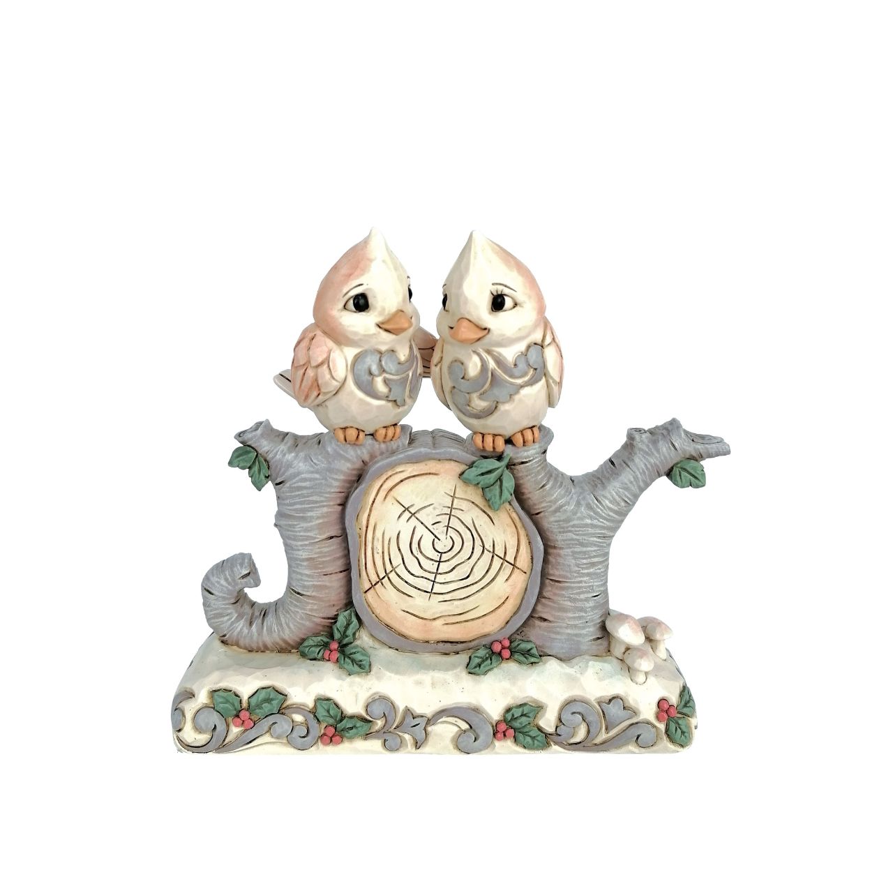 This charming Jim Shore design features two birds perched atop logs shaped into the word "Joy," embodying the spirit of love. Adorned with intricate rosemaling and surrounded by forest flowers, the piece captures the warmth of togetherness.