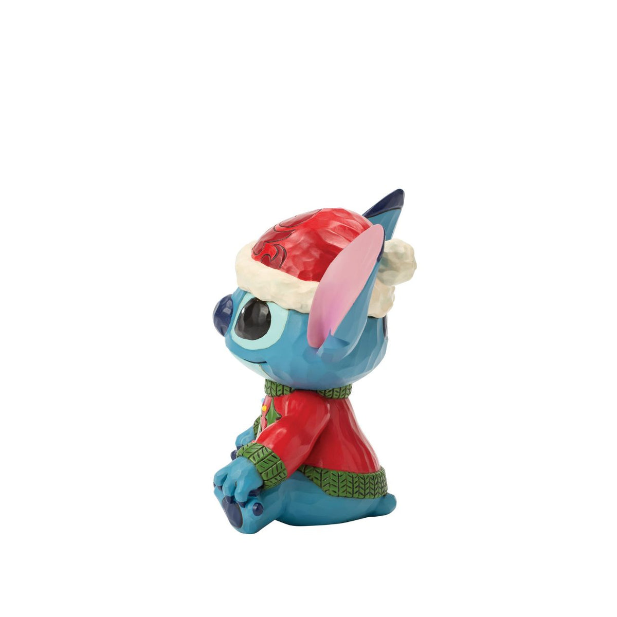 Stitch brings holiday humour to life in this glowing Jim Shore bust with an LED lit Christmas sweater. Wearing his sweater and Santa hat with a smile, the mischievous alien proves holiday magic spans across the universe with festive folk art style.