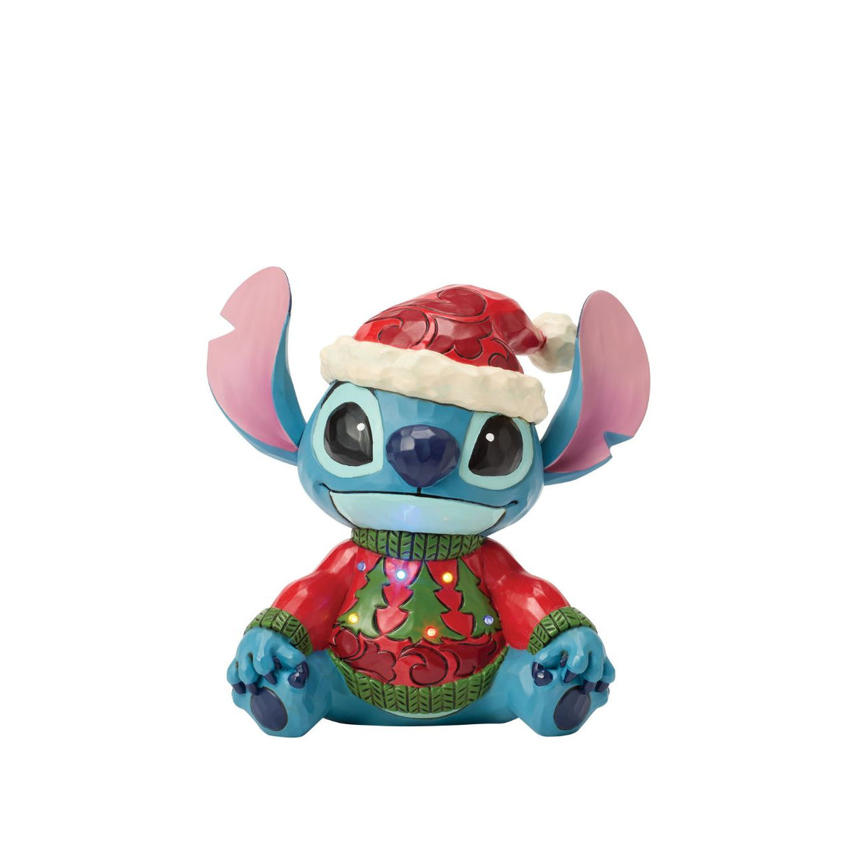 Stitch brings holiday humour to life in this glowing Jim Shore bust with an LED lit Christmas sweater. Wearing his sweater and Santa hat with a smile, the mischievous alien proves holiday magic spans across the universe with festive folk art style.