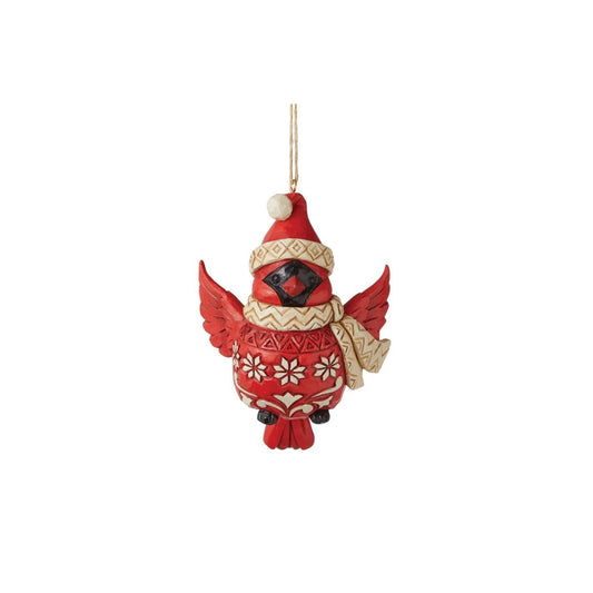 Tweet your heart out alongside this cheery cardinal ornament. Wearing a patterned Santa hat and matching scarf, this charismatic cutie seems to flutter between your tree's branches with holiday excitement. With folksy patterned plumage, he soars.