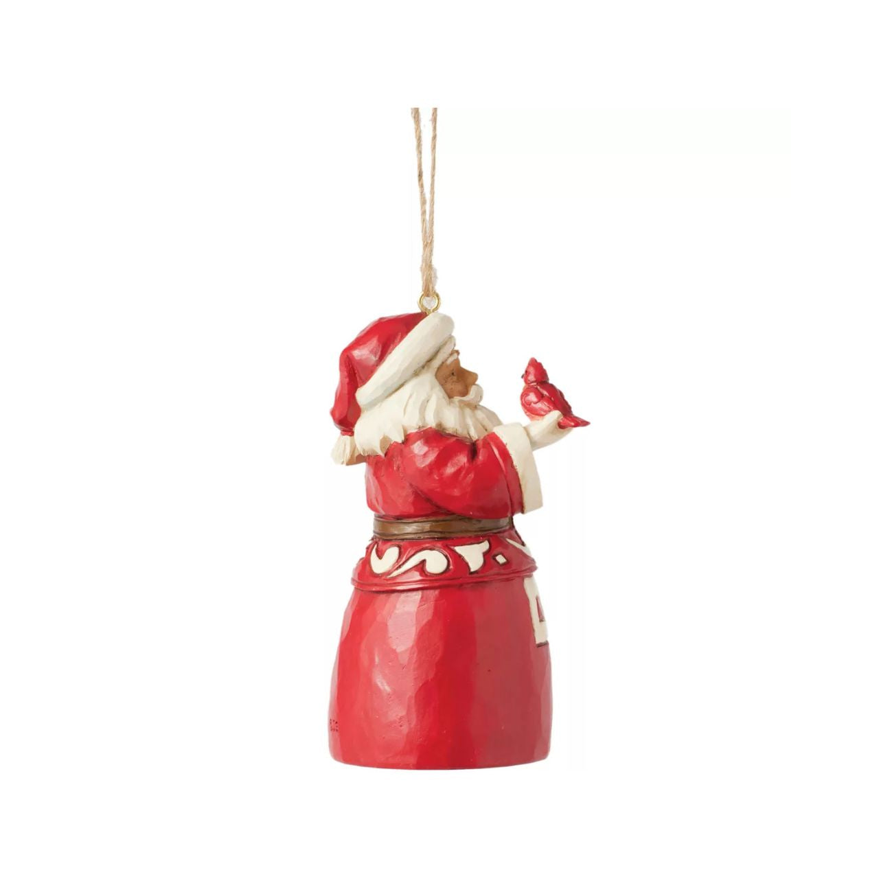 This charming Nordic Noel Jim Shore ornament features Santa holding a vibrant cardinal, embodying the joy of the season. His coat showcases the artist's iconic patchwork patterning and delicate rosemaling, adding a delightful touch of artistry to your tree.