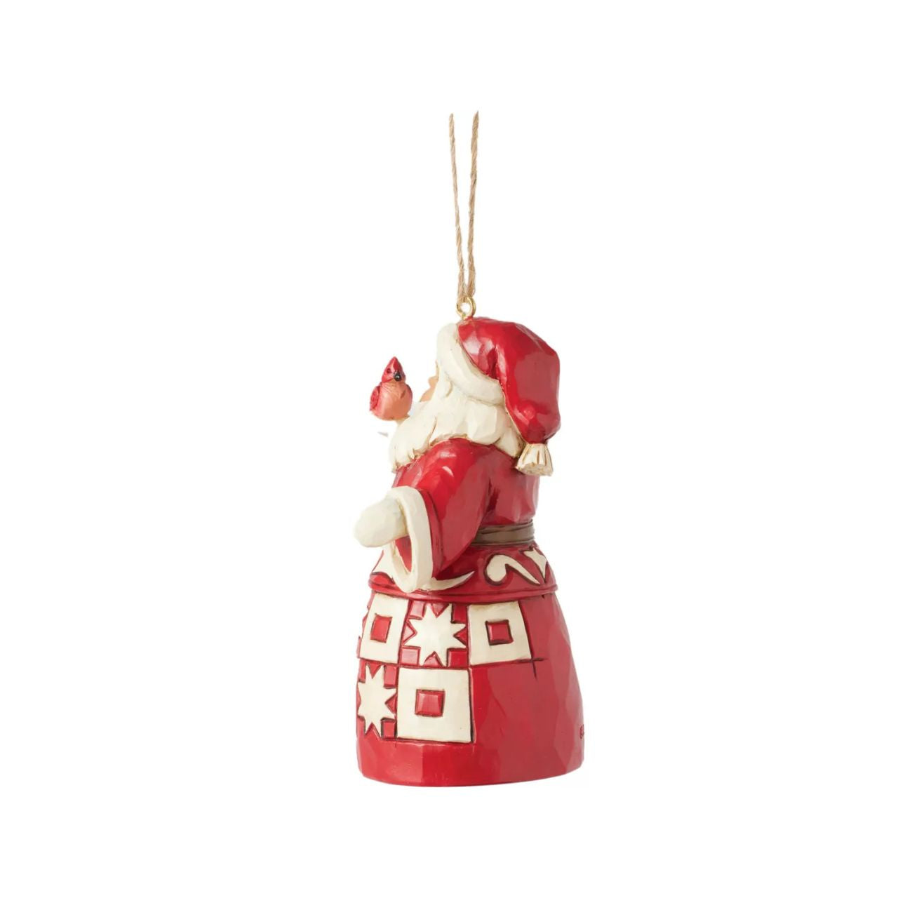 This charming Nordic Noel Jim Shore ornament features Santa holding a vibrant cardinal, embodying the joy of the season. His coat showcases the artist's iconic patchwork patterning and delicate rosemaling, adding a delightful touch of artistry to your tree.