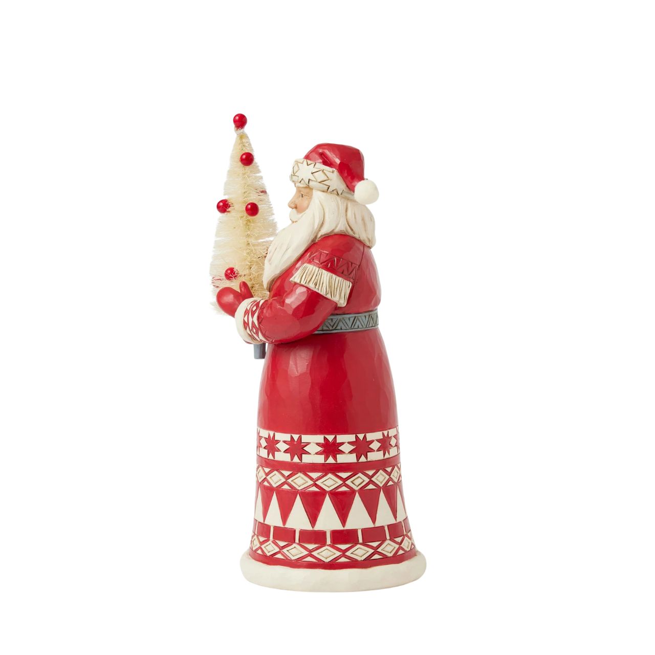 This charming Jim Shore Nordic Noel ornament features Santa holding a vibrant cardinal, embodying the joy of the season. His coat showcases the artist's iconic patchwork patterning and delicate rosemaling, adding a delightful touch of artistry to your tree.