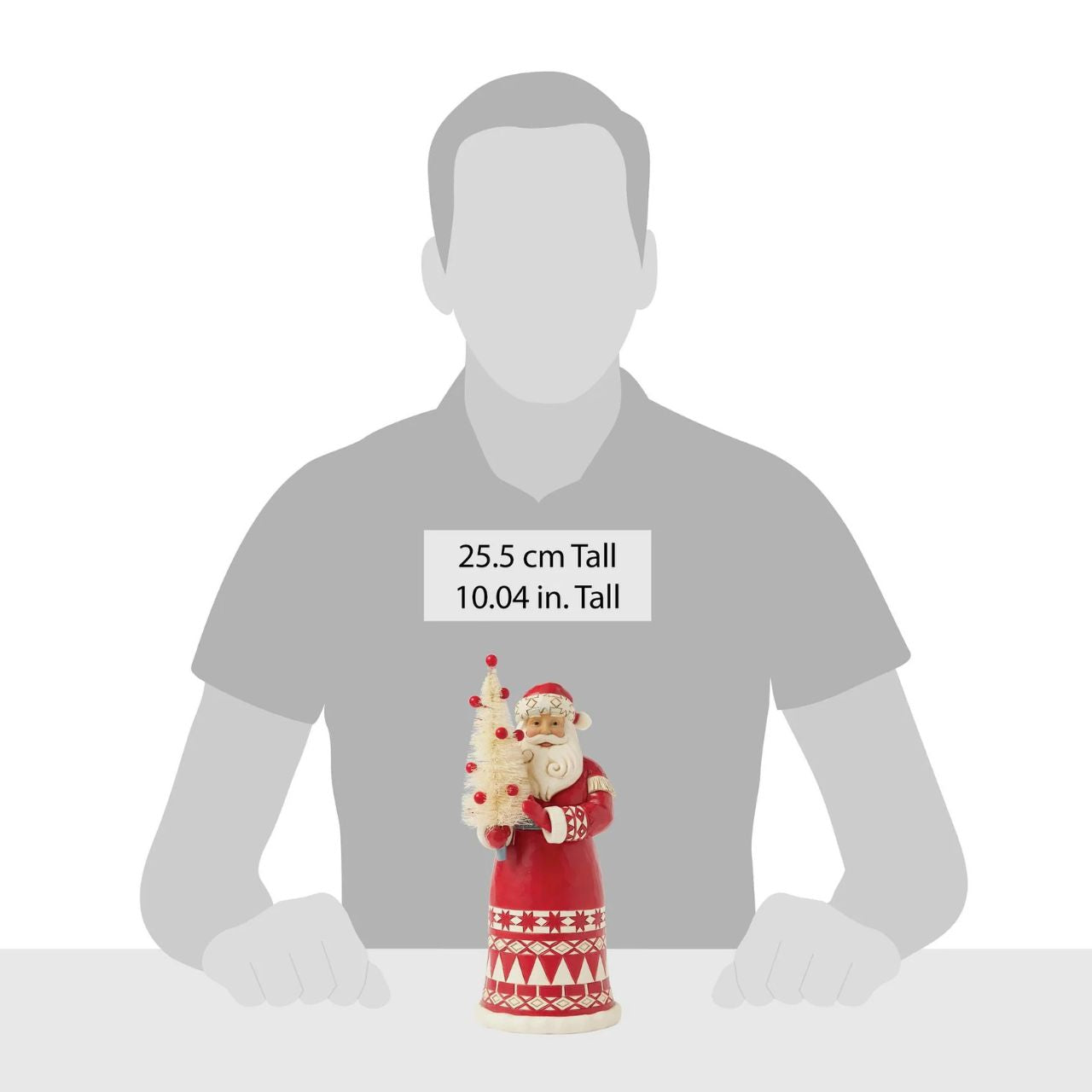 This charming Jim Shore Nordic Noel ornament features Santa holding a vibrant cardinal, embodying the joy of the season. His coat showcases the artist's iconic patchwork patterning and delicate rosemaling, adding a delightful touch of artistry to your tree.