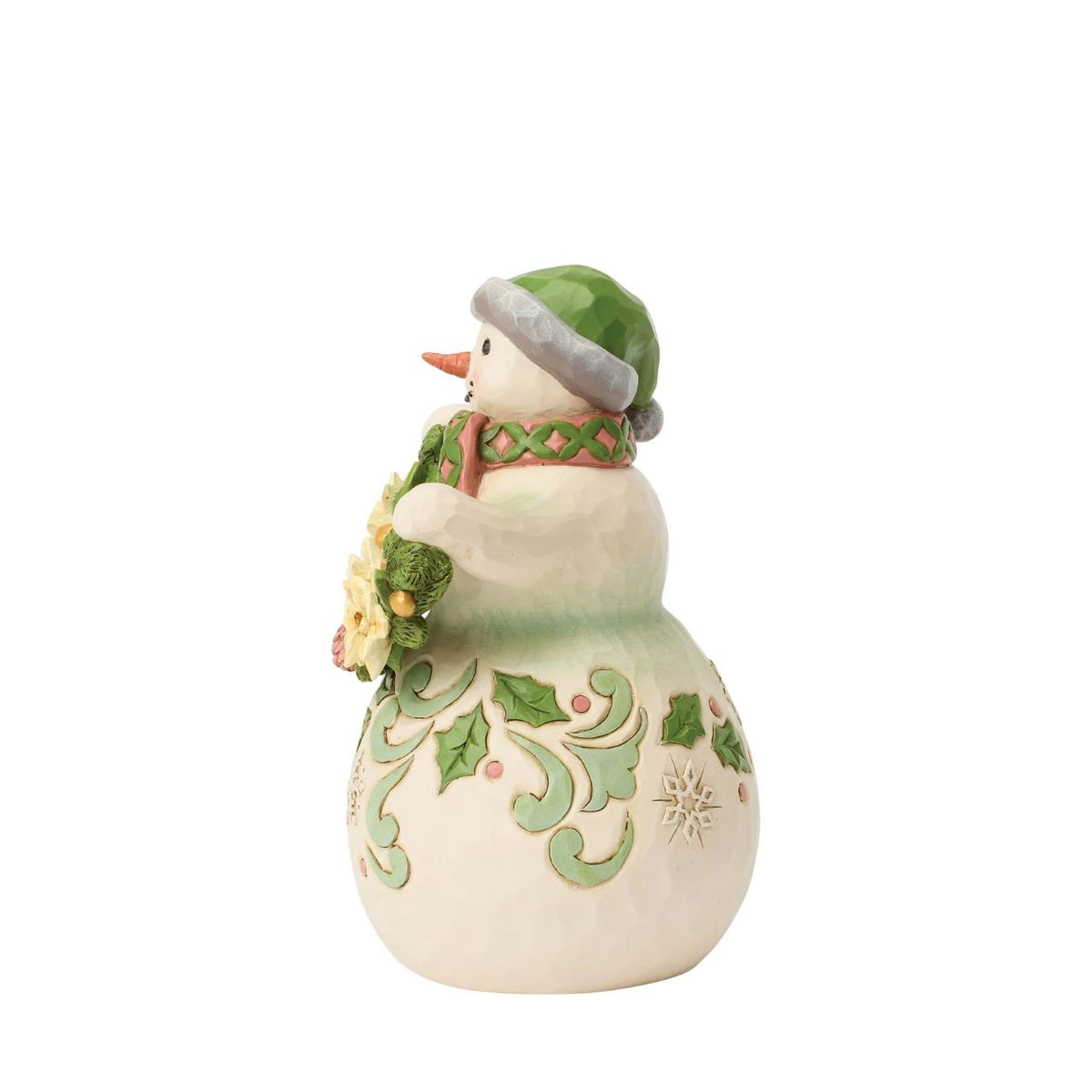 With a garland of pristine poinsettias draped in his snowy arms, this snowman radiates winter elegance. Jim Shore's hand-painted details and folk-art patterns turn this simple snowman into a heartfelt holiday scene, feeling like a frosty hug.