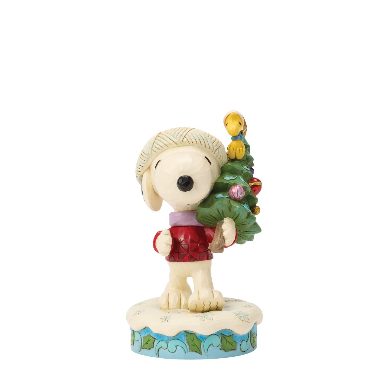Snoopy and Woodstock bring home a decorated Christmas tree in this heart warming Jim Shore scene. With festive folk art touches, it's a charming reminder of holiday traditions and lifelong friendship. Celebrate the season with your favourite Peanuts.