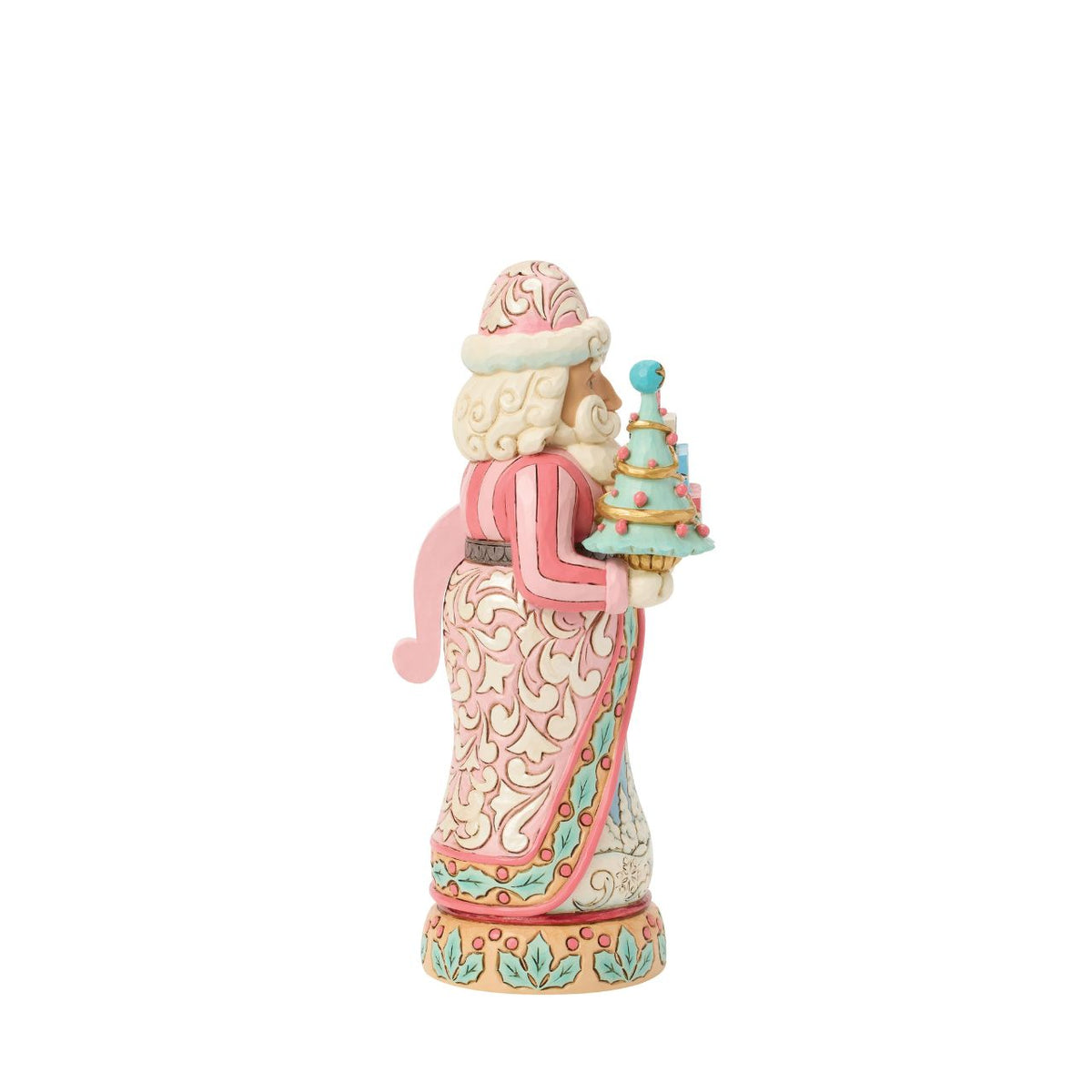 This sweet Santa nutcracker wears soft sherbet tones, blending candy-coloured charm with timeless holiday magic. Jim Shore's detailed rosemaling swirls across his coat, giving a fresh and playful twist to a traditional design.