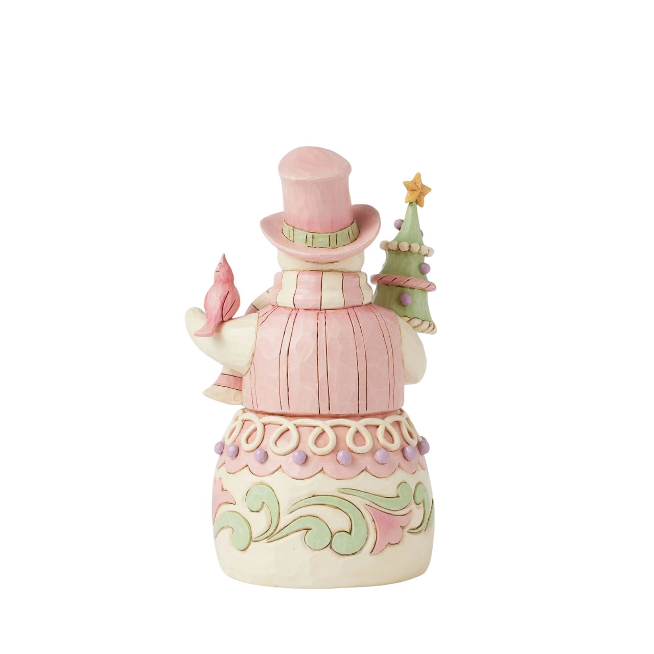 This whimsical Heartwood Sweets pastel pink snowman by Jim Shore radiates charm with his rosemaling patterns, sprinkles, and icing details, embodying the essence of holiday cheer. He lovingly holds a decorated tree and a cardinal.