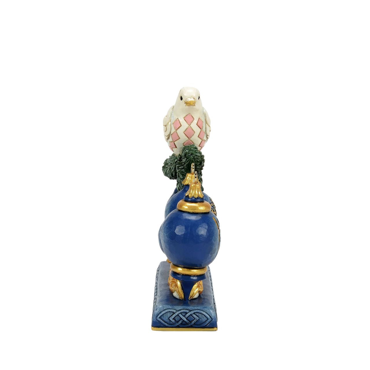 This elegant Jim Shore ornament features a beautifully patterned dove resting on a pine sprig, with a blue ornament adorned with a golden snowflake hanging gracefully below. The rich colours and details bring a sense of peace to your holiday home.