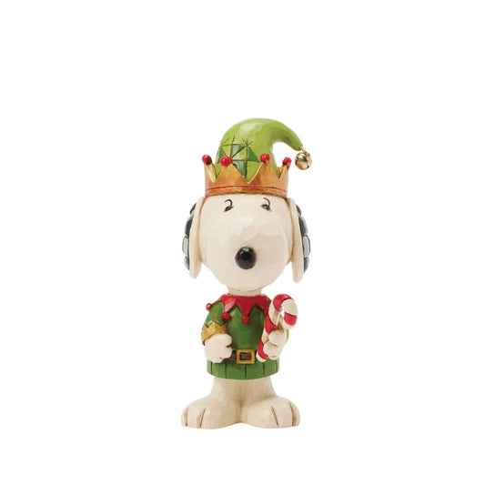 Add a touch of festive cheer to your holiday collection with this miniature Jim Shore design of Snoopy dressed as a cheerful elf. Holding a candy cane and sporting a bright smile, Snoopy embodies the joy of the season in delightful detail.