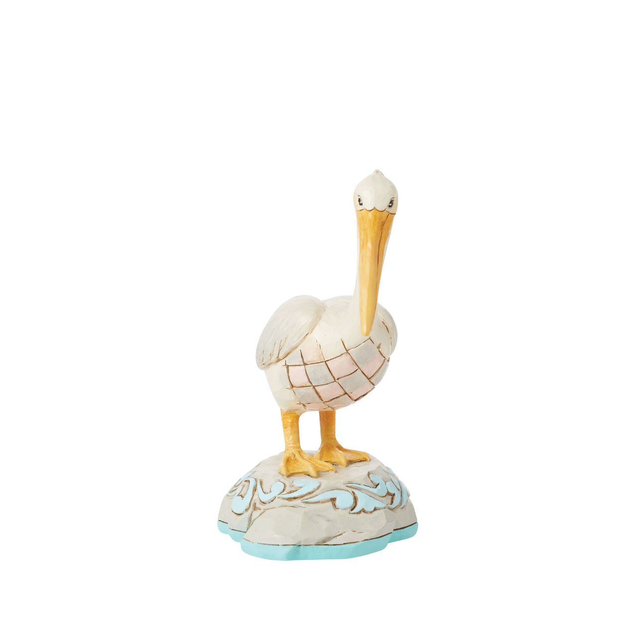 Embrace coastal charm with this magnificent Jim Shore pelican figurine, adorned with the artist's distinctive patchwork patterning, capturing the essence of seaside beauty. This stunning piece brings a touch of coastal elegance to any space.