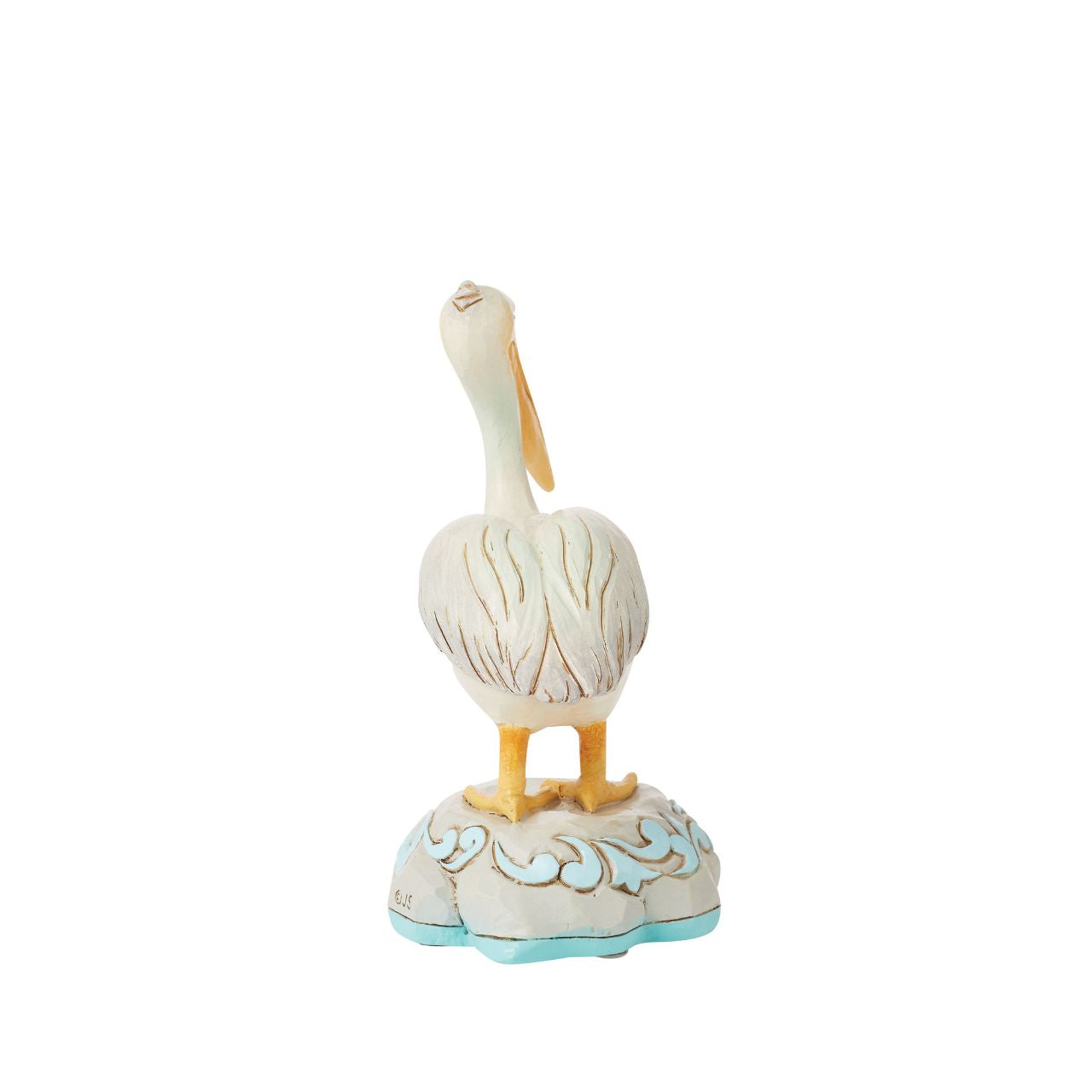 Embrace coastal charm with this magnificent Jim Shore pelican figurine, adorned with the artist's distinctive patchwork patterning, capturing the essence of seaside beauty. This stunning piece brings a touch of coastal elegance to any space.
