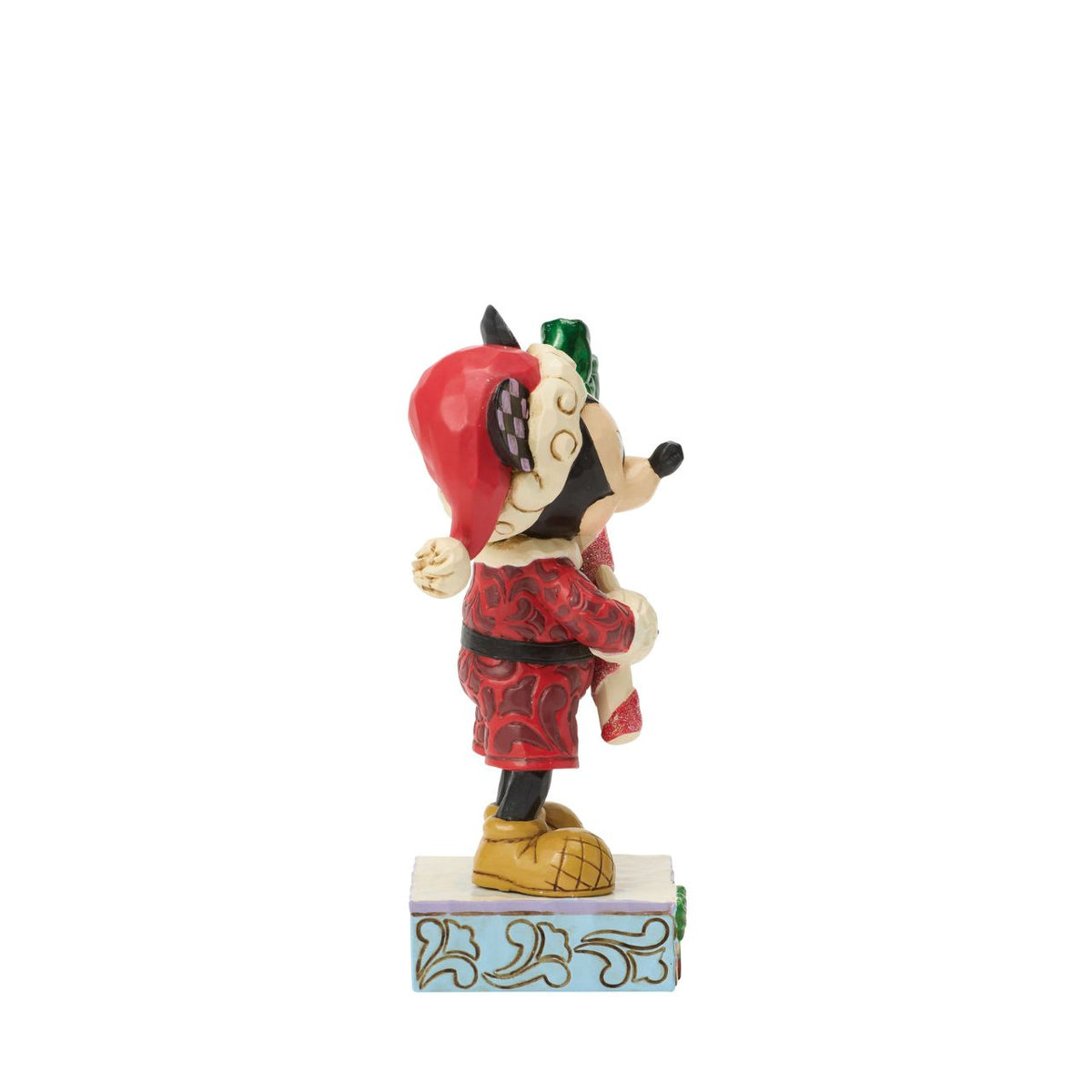 Mickey holds a giant candy cane in this festive Jim Shore design. With a playful pose, Mickey is dressed in a Santa hat and red coat with rosemaling details, he adds a touch of holiday sweetness and Disney magic to your Christmas traditions.