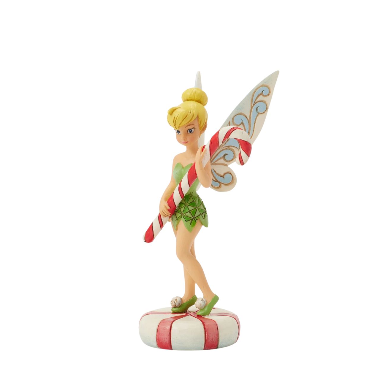 In this enchanting Jim Shore design, Tinker Bell stands atop a vibrant peppermint, delicately holding a candy cane with a sweet smile that radiates holiday warmth. Her enchanting presence brings a touch of pixie dust and magic to the holiday season.