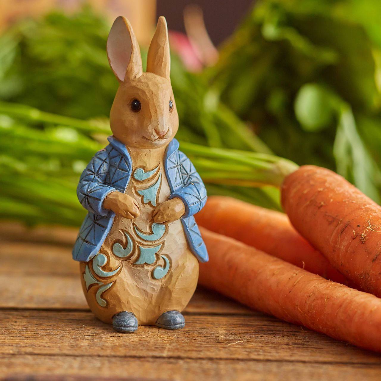 This charming Peter Rabbit figurine will make the perfect gift for any Beatrix Potter lover. Donning his classic blue jacket, the beloved rabbit is styled in beautiful Jim Shore patchwork detail around his coat.
