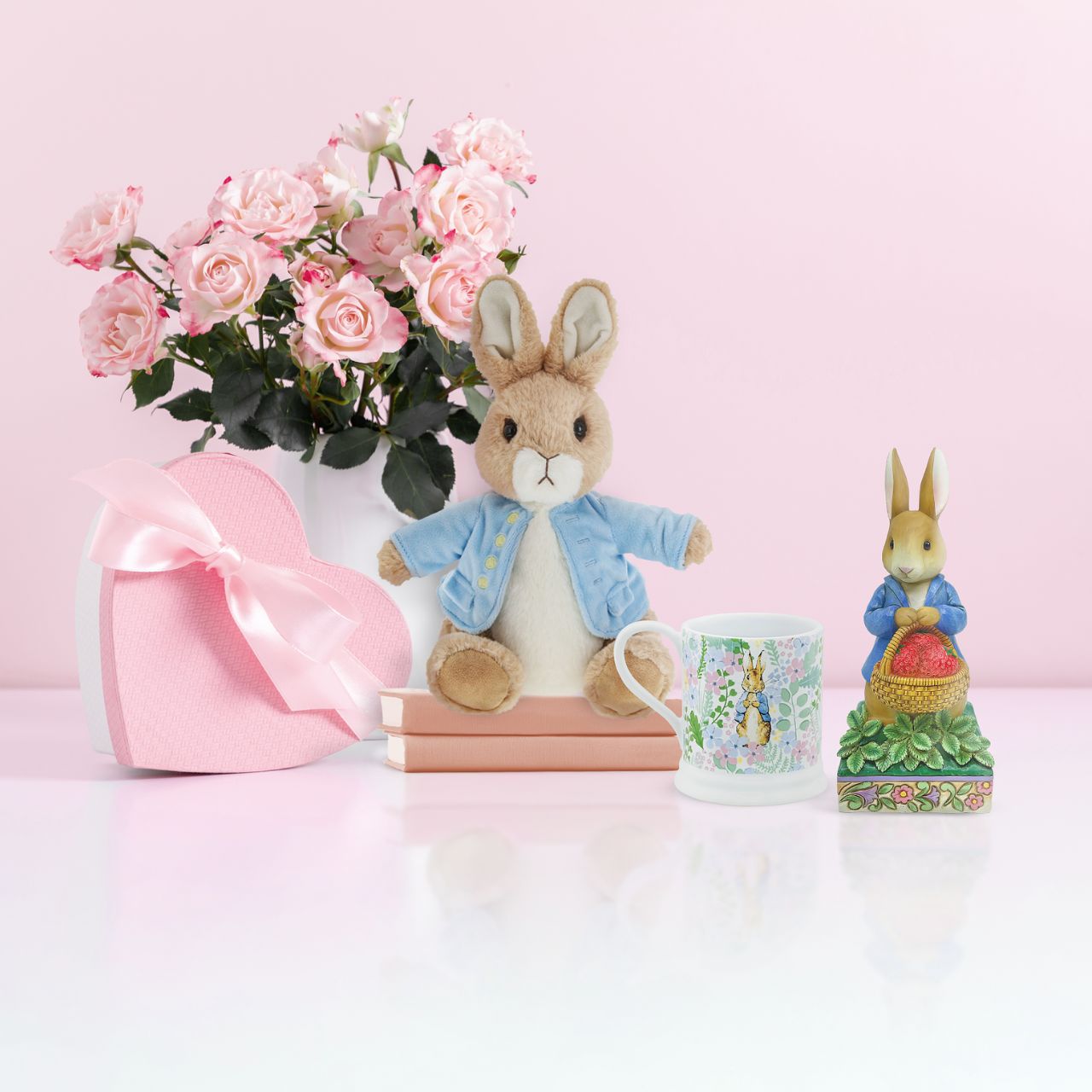 Peter Rabbit with Basket of Strawberries Figurine Made from cast stone. Packed in a branded gift box. Unique variations should be expected as this product is hand painted. Not a toy or children's product. Intended for adults.