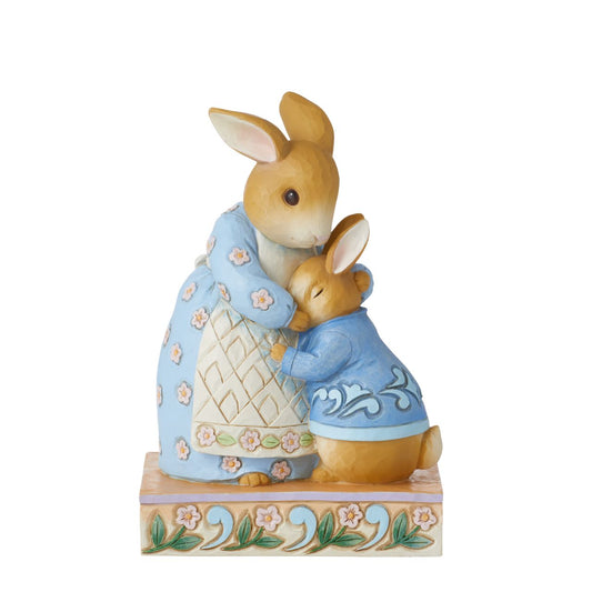 Beatrix Potter Peter Rabbit with Mrs Rabbit Figurine  Jim Shore uplifts the treasured children's characters in this darling miniature. Beloved bunny, Peter Rabbit, melts into his mother's caring embrace. Holding her sweet boy close, she provides all the encouragement he needs for a day of adventuring.
