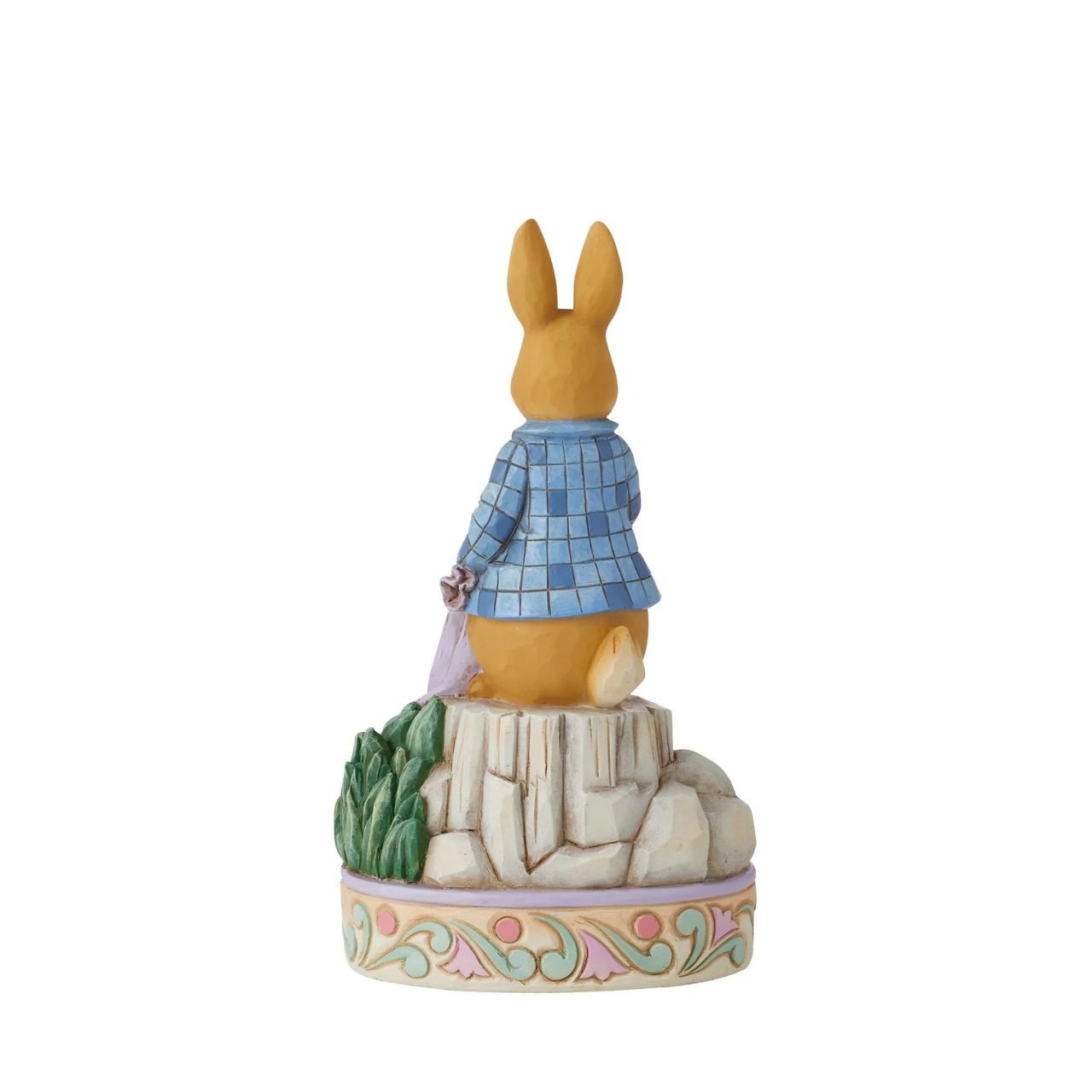 Always exploring in and around the garden, Peter Rabbit plays amongst the onions in this sweet figurine by Jim Shore. Wearing his iconic blue jacket Peter holds his red handkerchief inquisitively in the onion plot, indecisive on his next snack.