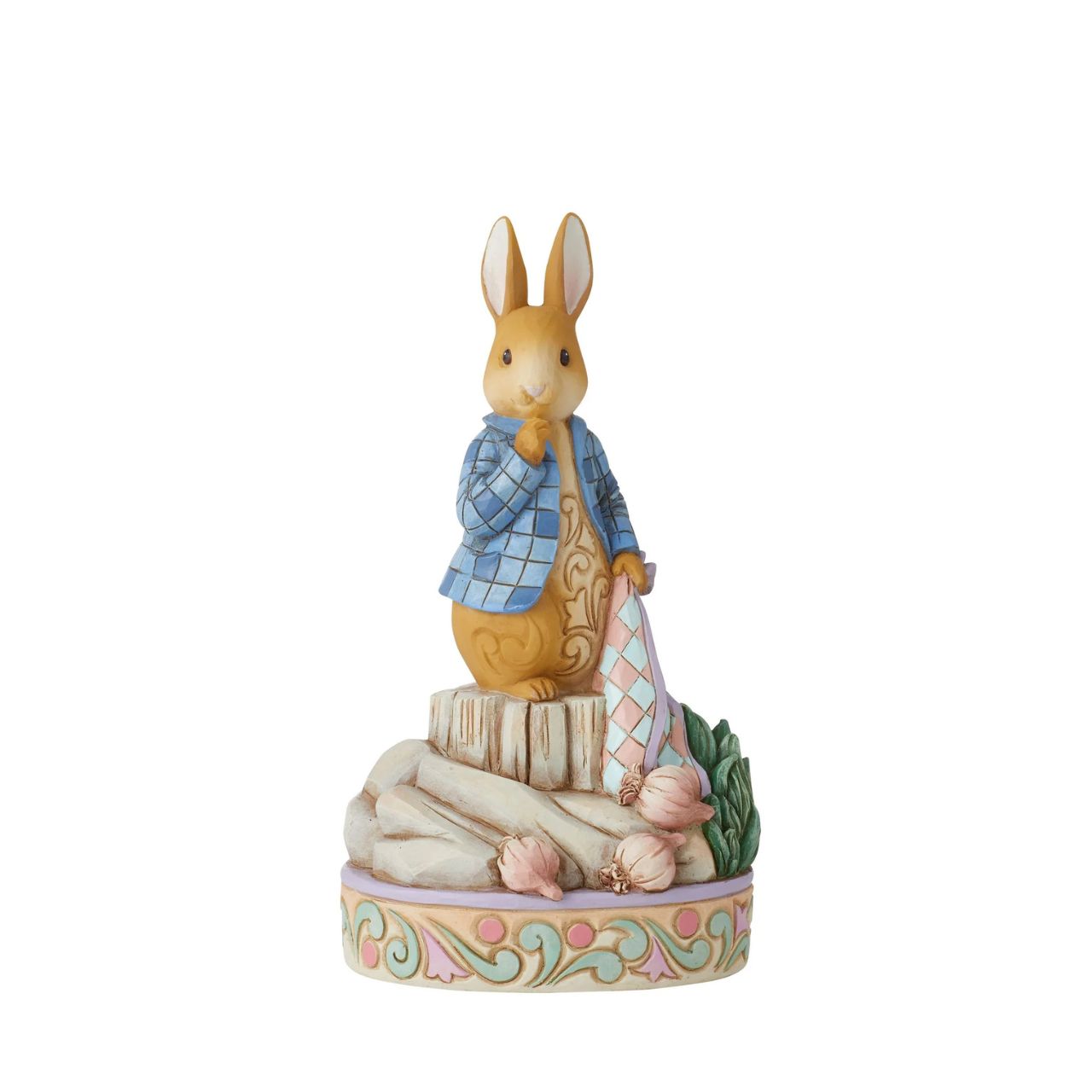 Always exploring in and around the garden, Peter Rabbit plays amongst the onions in this sweet figurine by Jim Shore. Wearing his iconic blue jacket Peter holds his red handkerchief inquisitively in the onion plot, indecisive on his next snack.