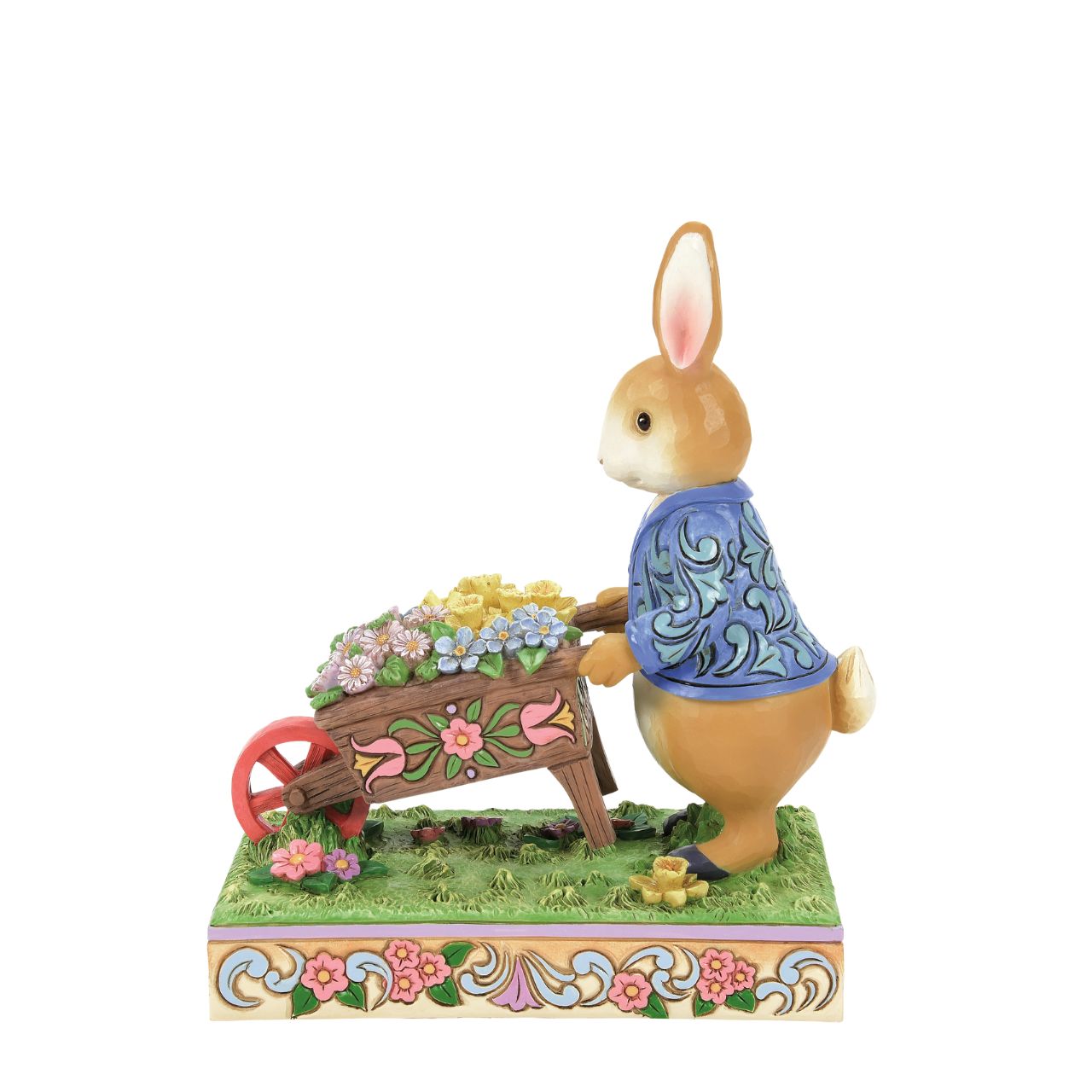 Peter Rabbit with Wheelbarrow of Flowers - Wearing his signature blue coat, Peter Rabbit pushes a wheelbarrow full of inviting flowers in this beautiful creation. Designed by Jim Shore, this creation features a wealth of inspired rosemale details, enchanting craftsmanship, and cheerful colour.