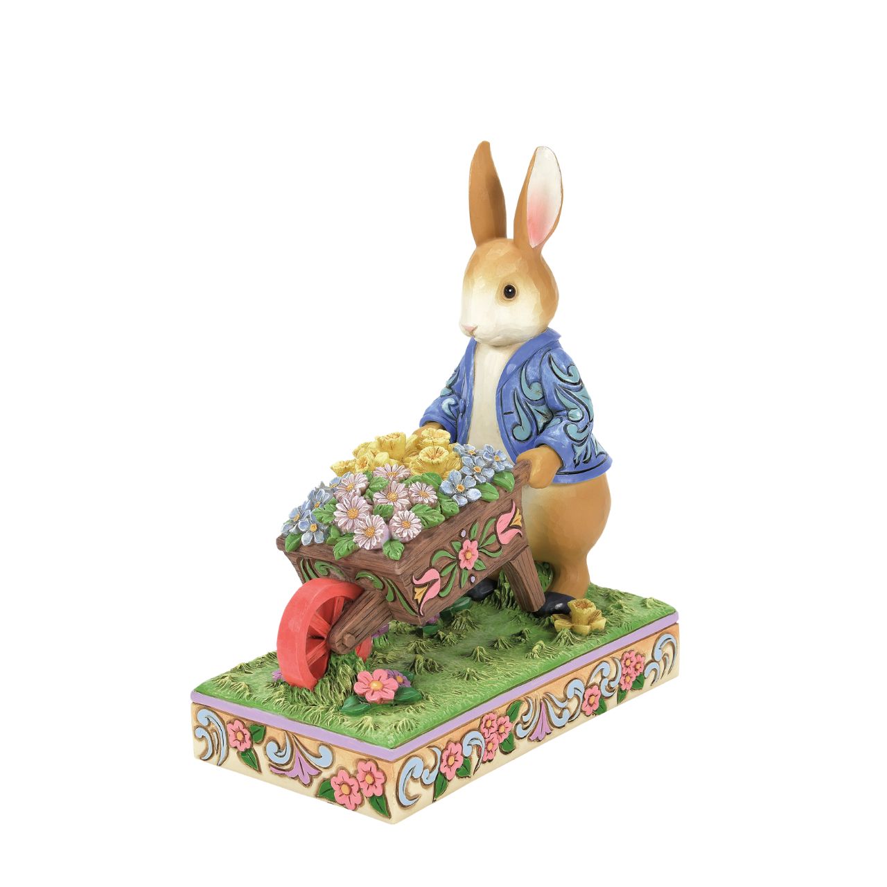 Peter Rabbit with Wheelbarrow of Flowers - Wearing his signature blue coat, Peter Rabbit pushes a wheelbarrow full of inviting flowers in this beautiful creation. Designed by Jim Shore, this creation features a wealth of inspired rosemale details, enchanting craftsmanship, and cheerful colour.