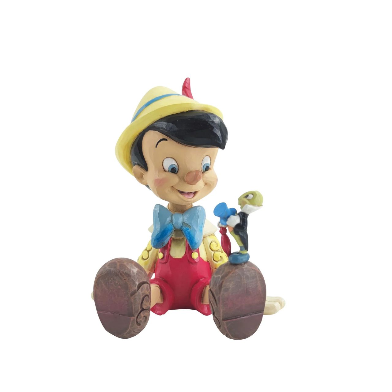 "Wishful and Wise" Jiminy Cricket is quite the dapper conscience in this design by Jim Shore, giving a tip o' his top hat as he smiles and gives his bestie Pinocchio a lesson about temptations.